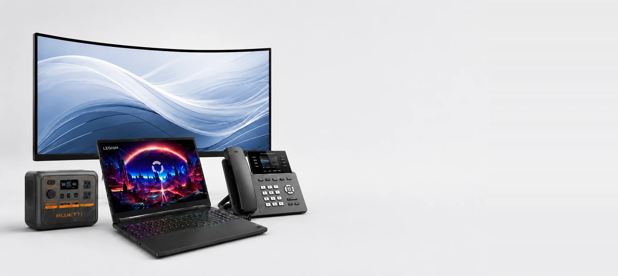 Home 1 Laptop, curved monitor, Bluetti power station and Grandstream IP phone